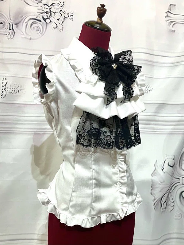 【MARBLE】マーブル 蝶型コサージュフリルタイ付きノースリーブブラウス:白黒